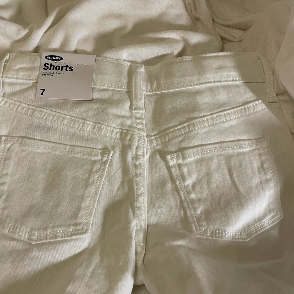 White jean shorts.Never used.Size 7 kids